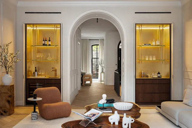 a living room with furniture large window and a flat screen tv