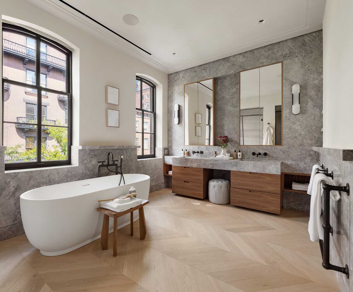 34 West 12th Street Manhattan, NY 10011 - Photo 30 of 53 a spacious bathroom with a bathtub sink and mirror