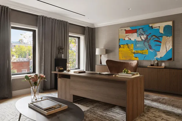 a living room with furniture a rug and a window