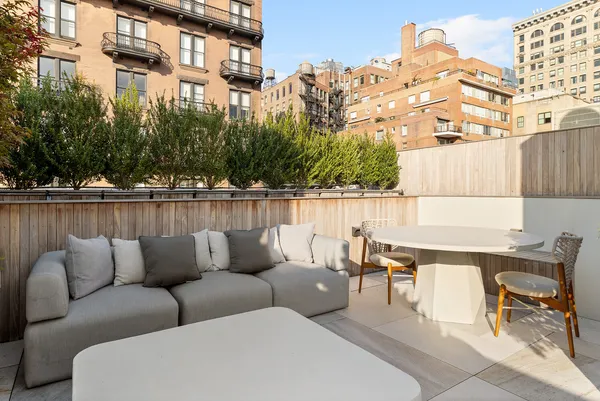 a view of a chairs and table on the terrace