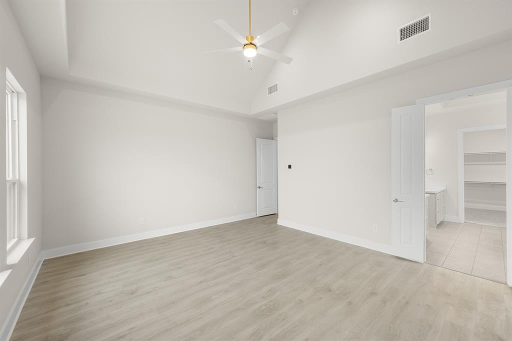 151 Talpin Lane Venus, TX 76084 - Photo 14 of 28 wooden floor in an empty room with a window