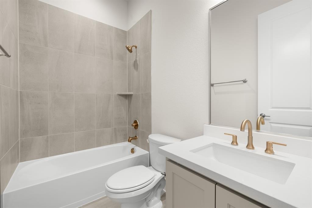 151 Talpin Lane Venus, TX 76084 - Photo 24 of 28 a bathroom with a sink a toilet and a bathtub