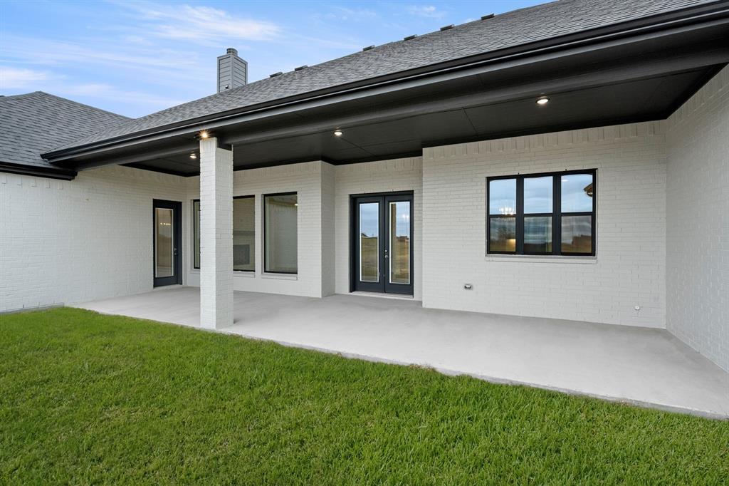 151 Talpin Lane Venus, TX 76084 - Photo 26 of 28 a backyard of a house with lots of green space