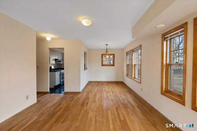 a view of livingroom with hardwood floor and hallway