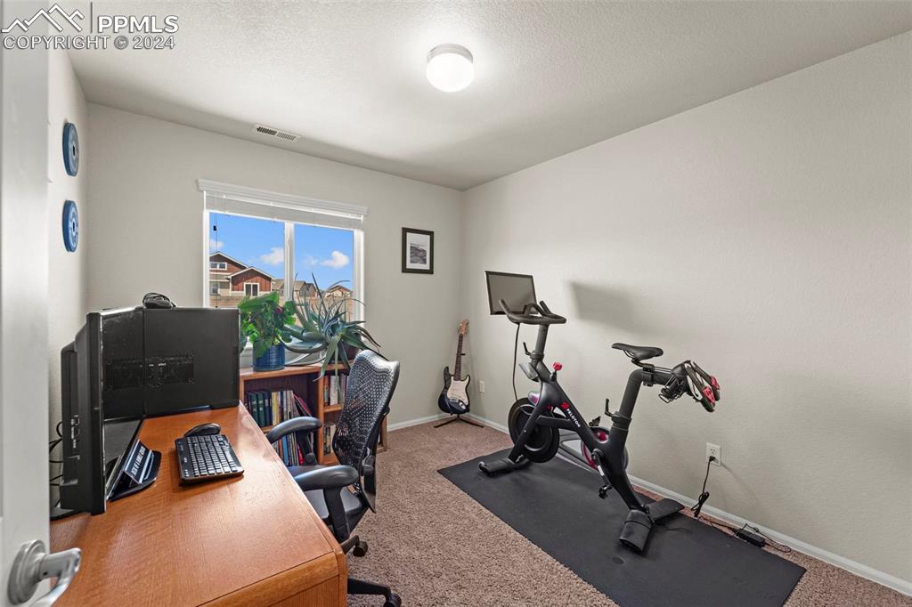 6310 Pilgrimage Road Colorado Springs, CO 80925 - Photo 20 of 31 a view of a room with gym equipment