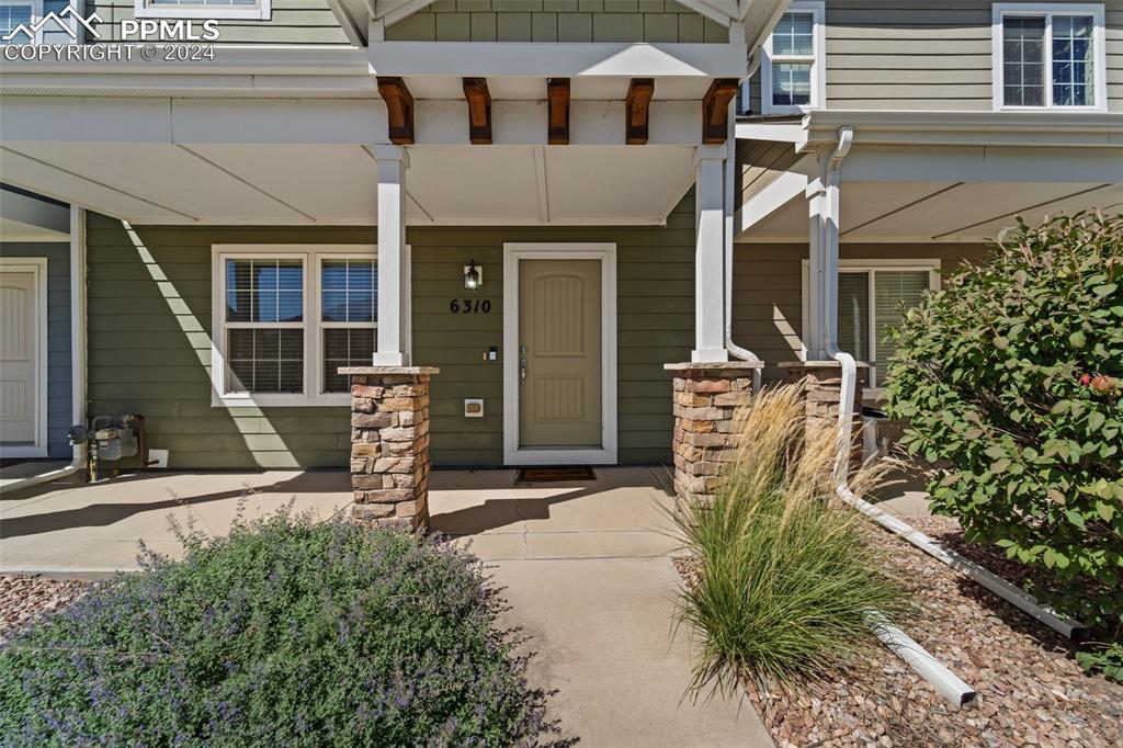 6310 Pilgrimage Road Colorado Springs, CO 80925 - Photo 4 of 31 a view of a chair with tables in patio