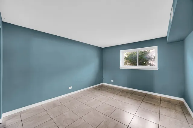 a view of a big room with windows