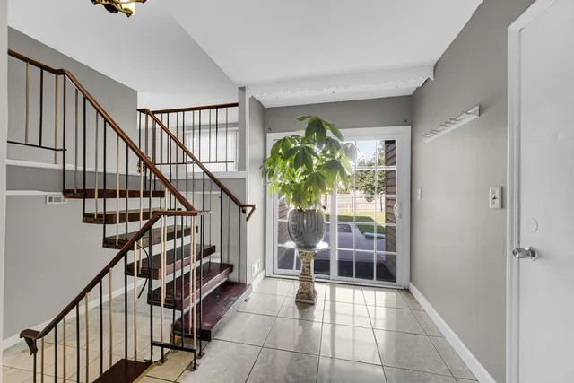 a view of entryway with stairs and wooden floor