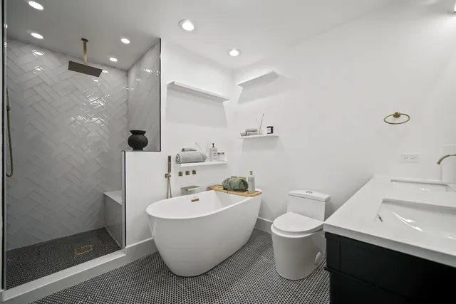 a bathroom with a toilet a sink and a bathtub