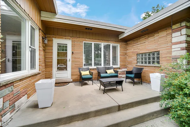a view of a patio with couches and chairs