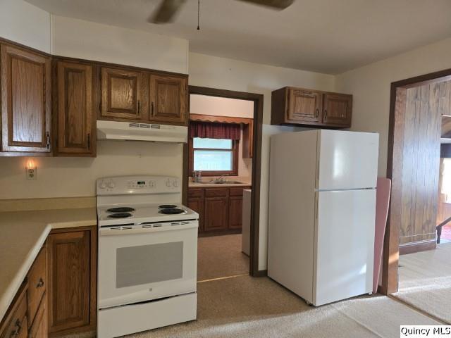1594 County Road 1500 Carthage, IL 62321 - Photo 3 of 26 a kitchen with stainless steel appliances granite countertop a refrigerator stove and cabinets