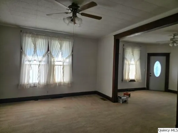 an empty room with windows