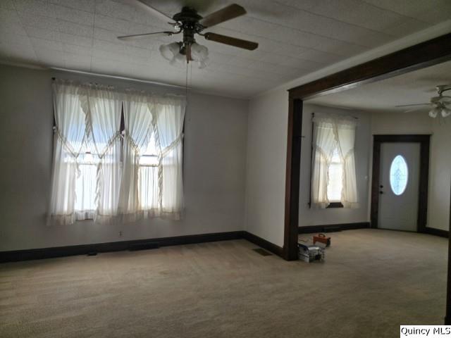 1594 County Road 1500 Carthage, IL 62321 - Photo 6 of 26 an empty room with windows
