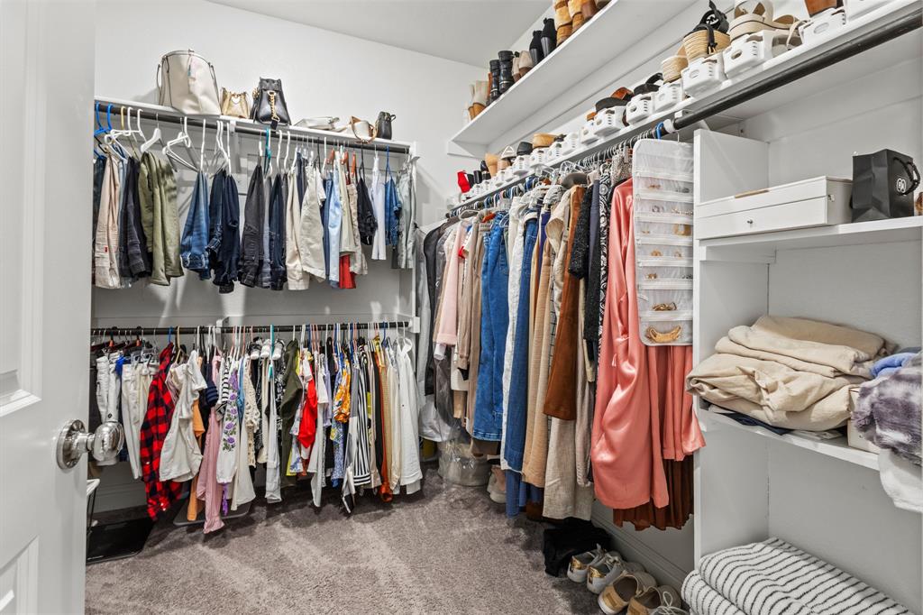 4220 Calla Drive Forney, TX 75126 - Photo 12 of 30 a view of walk in closet with clothes