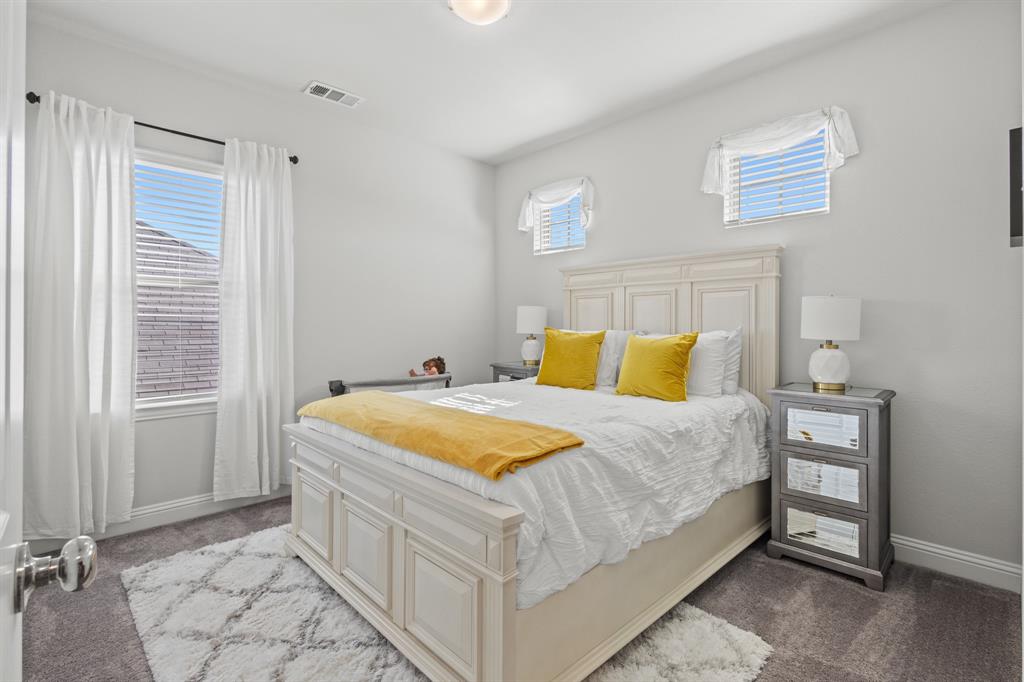 4220 Calla Drive Forney, TX 75126 - Photo 17 of 30 a bedroom with a bed and a window