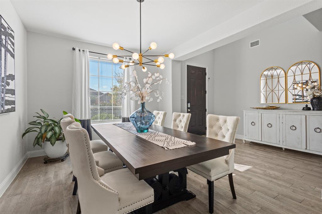 4220 Calla Drive Forney, TX 75126 - Photo 3 of 30 a view of a dining room with furniture window and wooden floor
