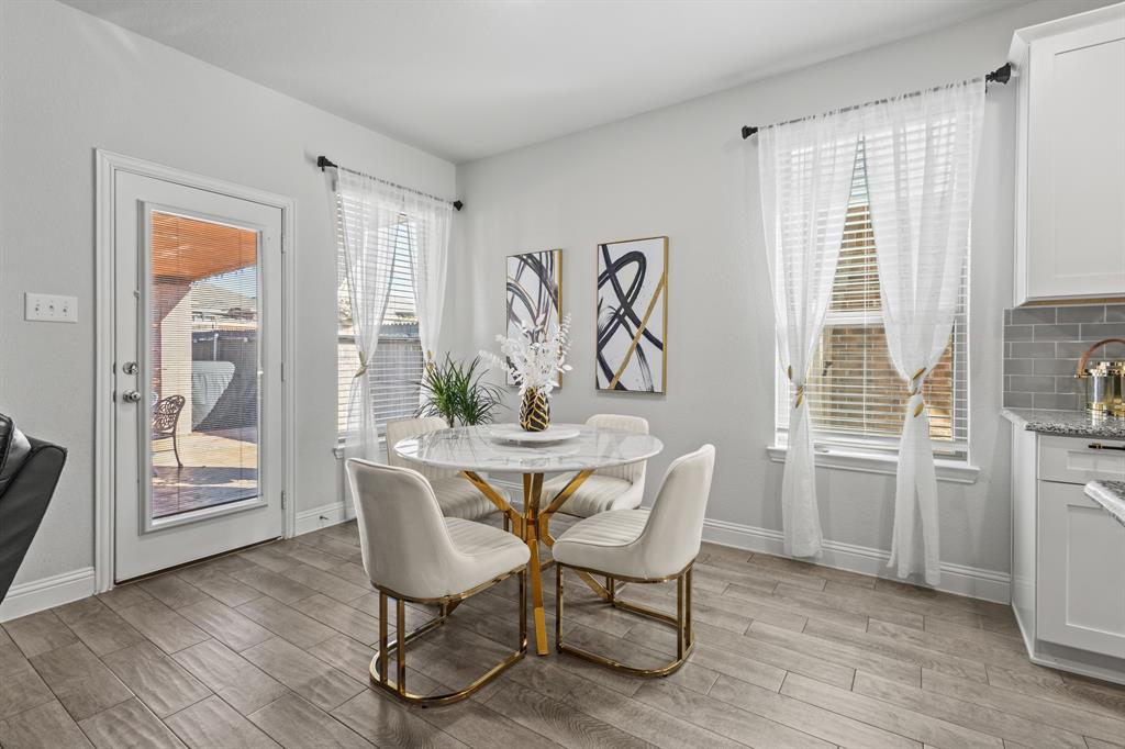 4220 Calla Drive Forney, TX 75126 - Photo 7 of 30 a dining room with furniture window wooden floor