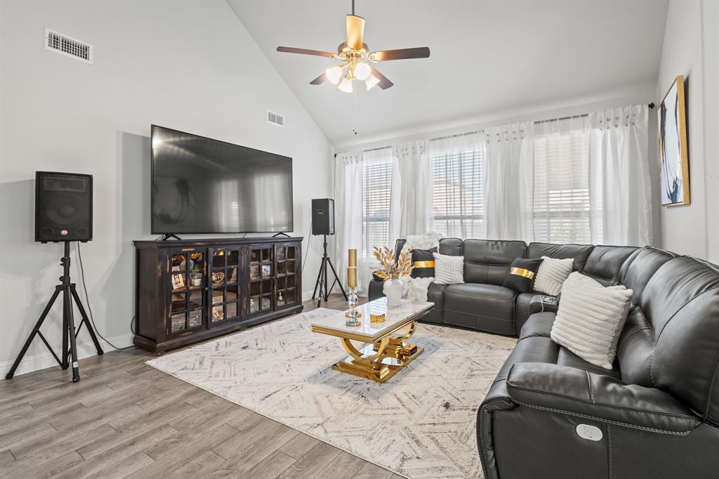 4220 Calla Drive Forney, TX 75126 - Photo 8 of 30 a living room with furniture and a flat screen tv