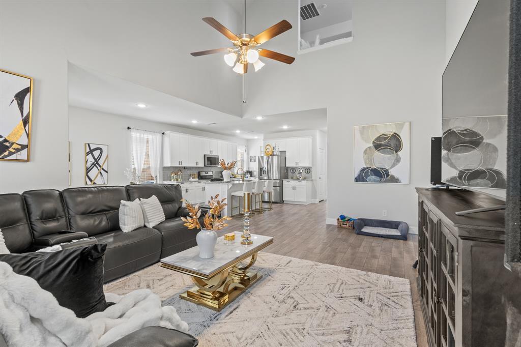 4220 Calla Drive Forney, TX 75126 - Photo 9 of 30 a living room with furniture and a kitchen view