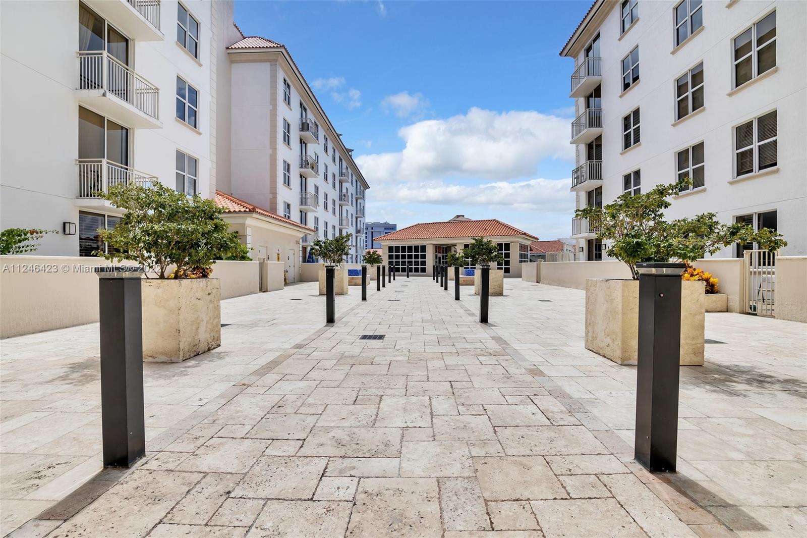 2030 Douglas Road, Unit 817 Coral Gables, FL 33134 - Photo 21 of 28 a view of a building with garden