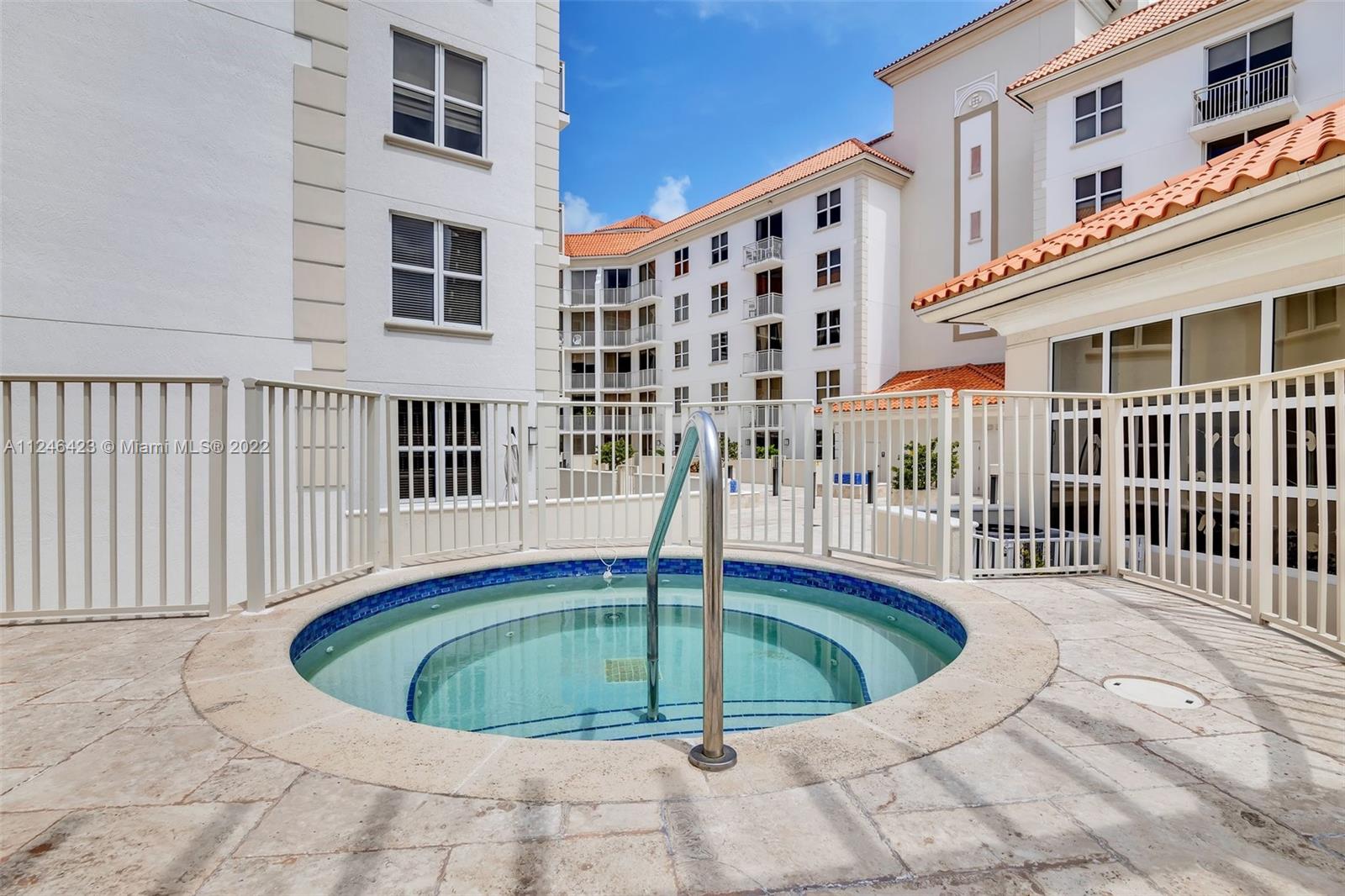 2030 Douglas Road, Unit 817 Coral Gables, FL 33134 - Photo 25 of 28 a view of a house with a swimming pool