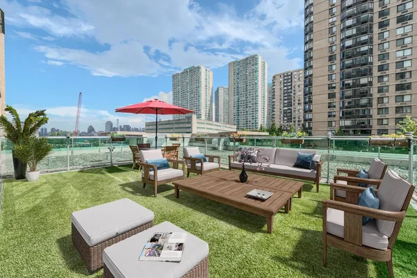 a view of a patio with couches chairs and a yard