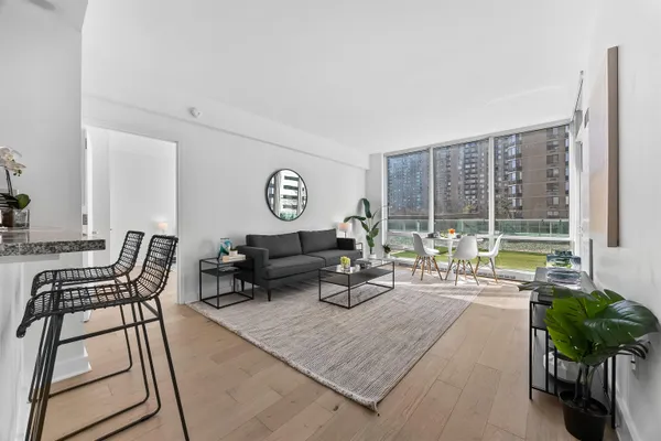 a living room with furniture and a large window