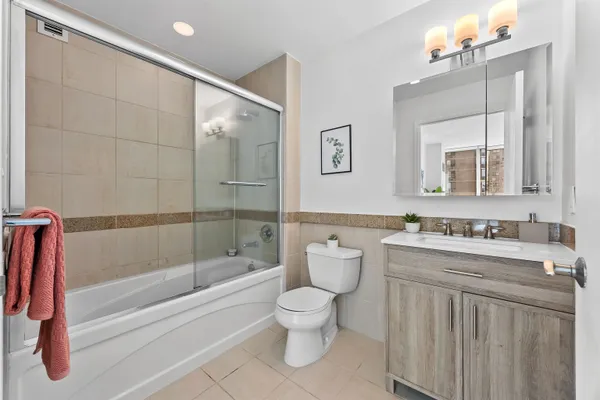 a bathroom with a toilet a sink and a bathtub