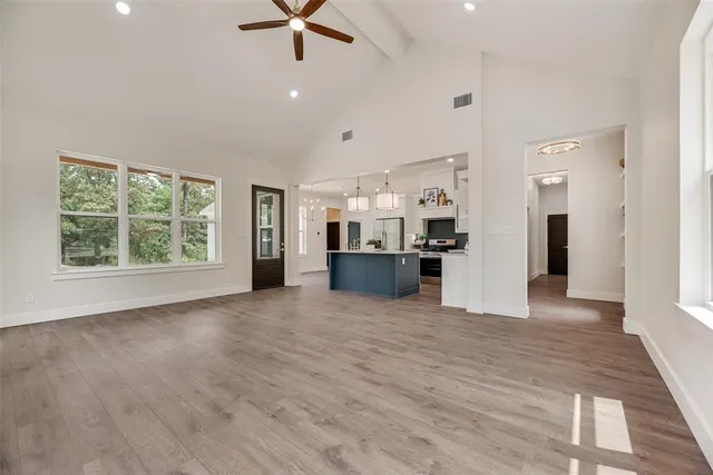 a view of a kitchen with a sink and a window