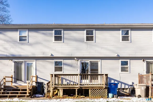 a view of a house with large windows