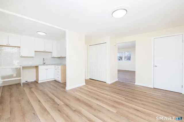 a view of kitchen with wooden floor