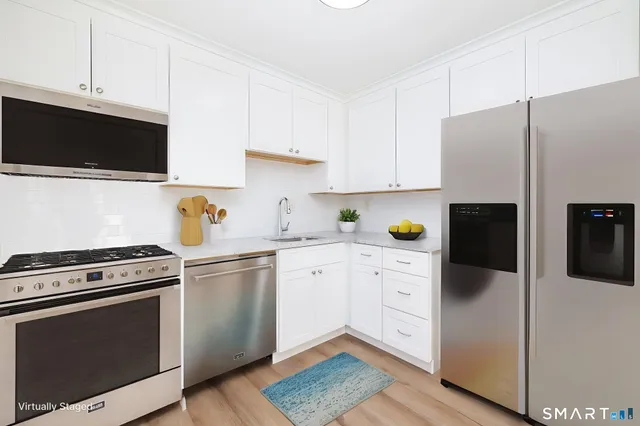 a kitchen with a stove microwave and cabinets
