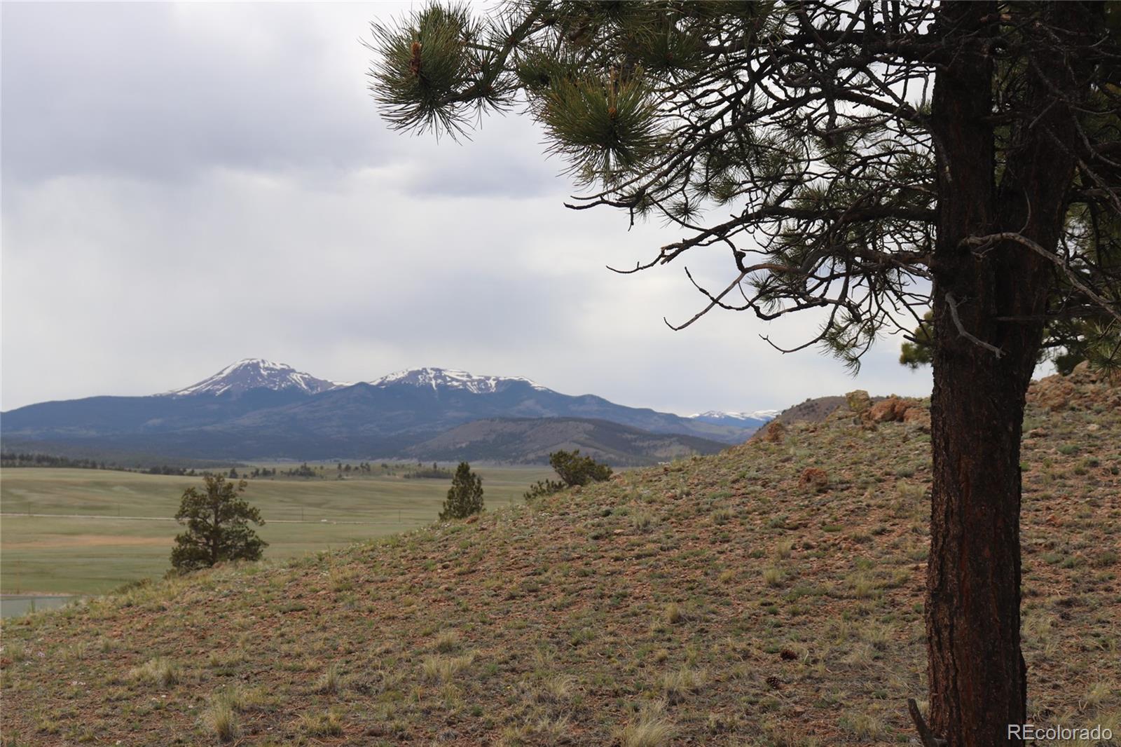 687 Corral Road Hartsel, CO 80449 - Photo 7 of 22 a view of a lake with mountains in the background