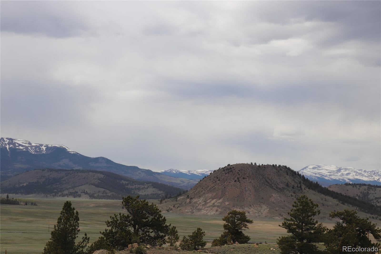 687 Corral Road Hartsel, CO 80449 - Photo 8 of 22 a view of mountains in middle of green field