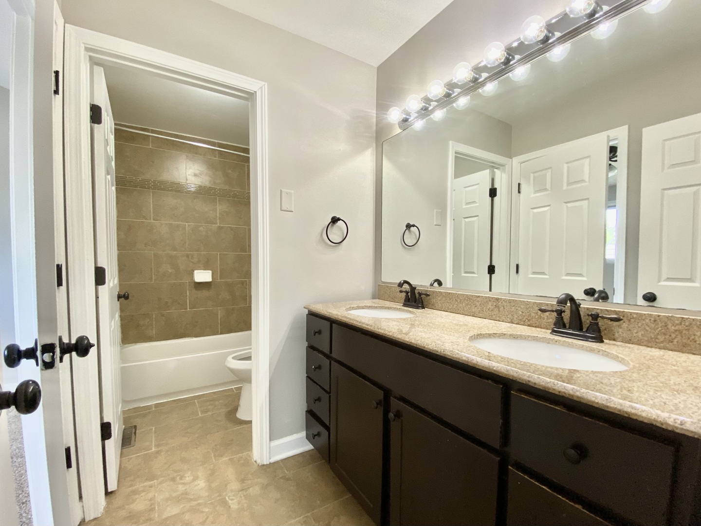 128 Timberlane Road Matteson, IL 60443 - Photo 14 of 28 a bathroom with a sink a toilet and shower