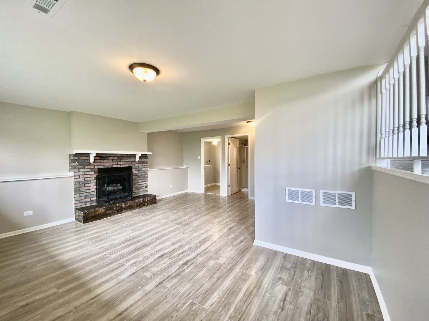 128 Timberlane Road Matteson, IL 60443 - Photo 20 of 28 an empty room with windows and a fireplace