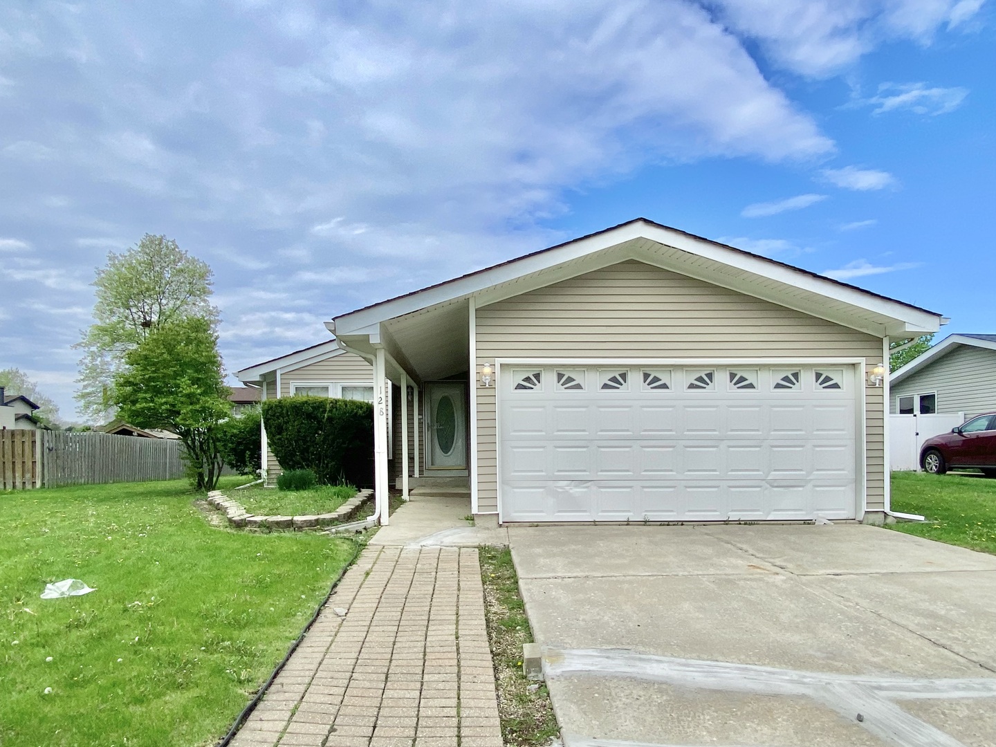 128 Timberlane Road Matteson, IL 60443 - Photo 2 of 28 a front view of a house with a garden