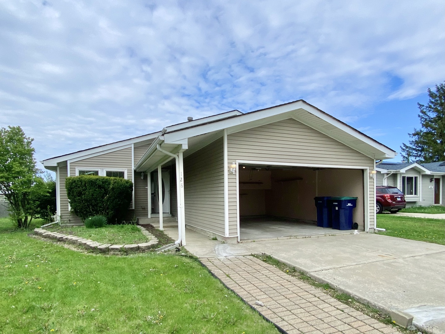 128 Timberlane Road Matteson, IL 60443 - Photo 27 of 28 front view of a house with a yard and potted plants