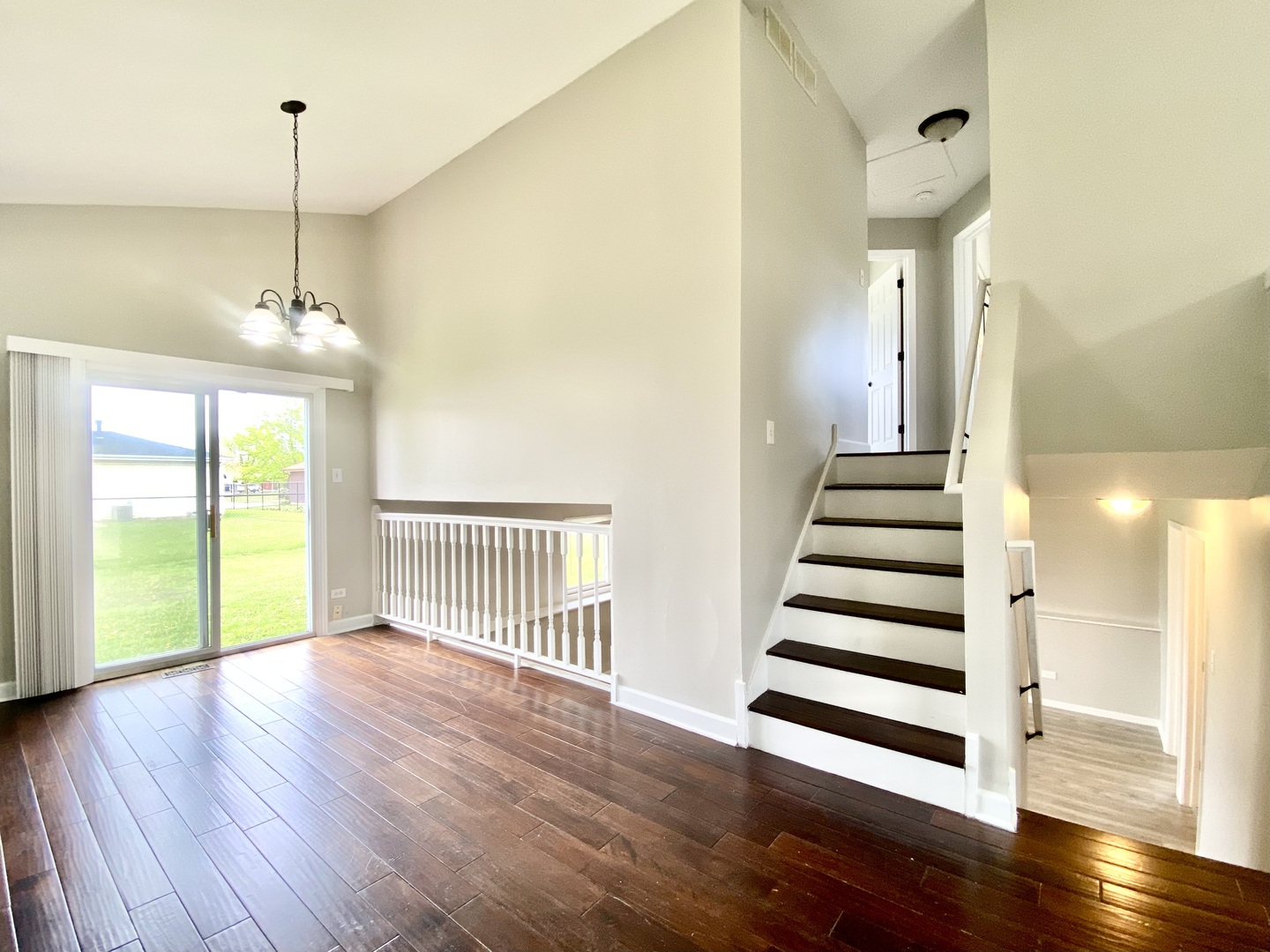 128 Timberlane Road Matteson, IL 60443 - Photo 6 of 28 a view of a room with wooden floor and stairs