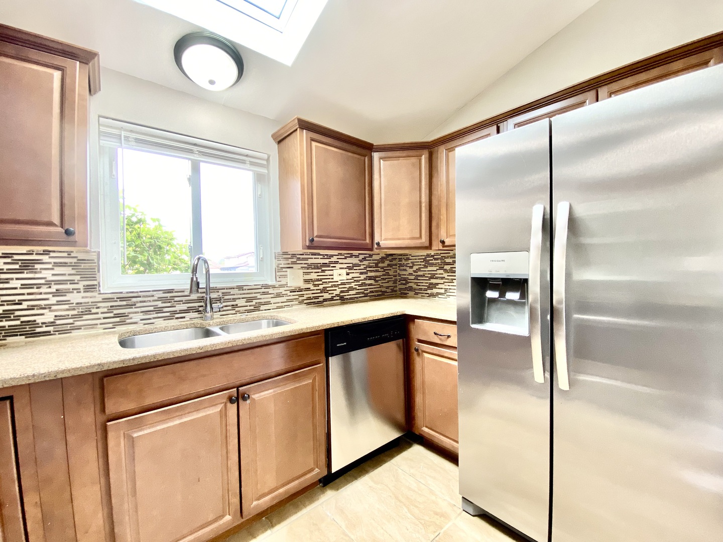 128 Timberlane Road Matteson, IL 60443 - Photo 9 of 28 a kitchen with stainless steel appliances granite countertop a sink window and cabinets