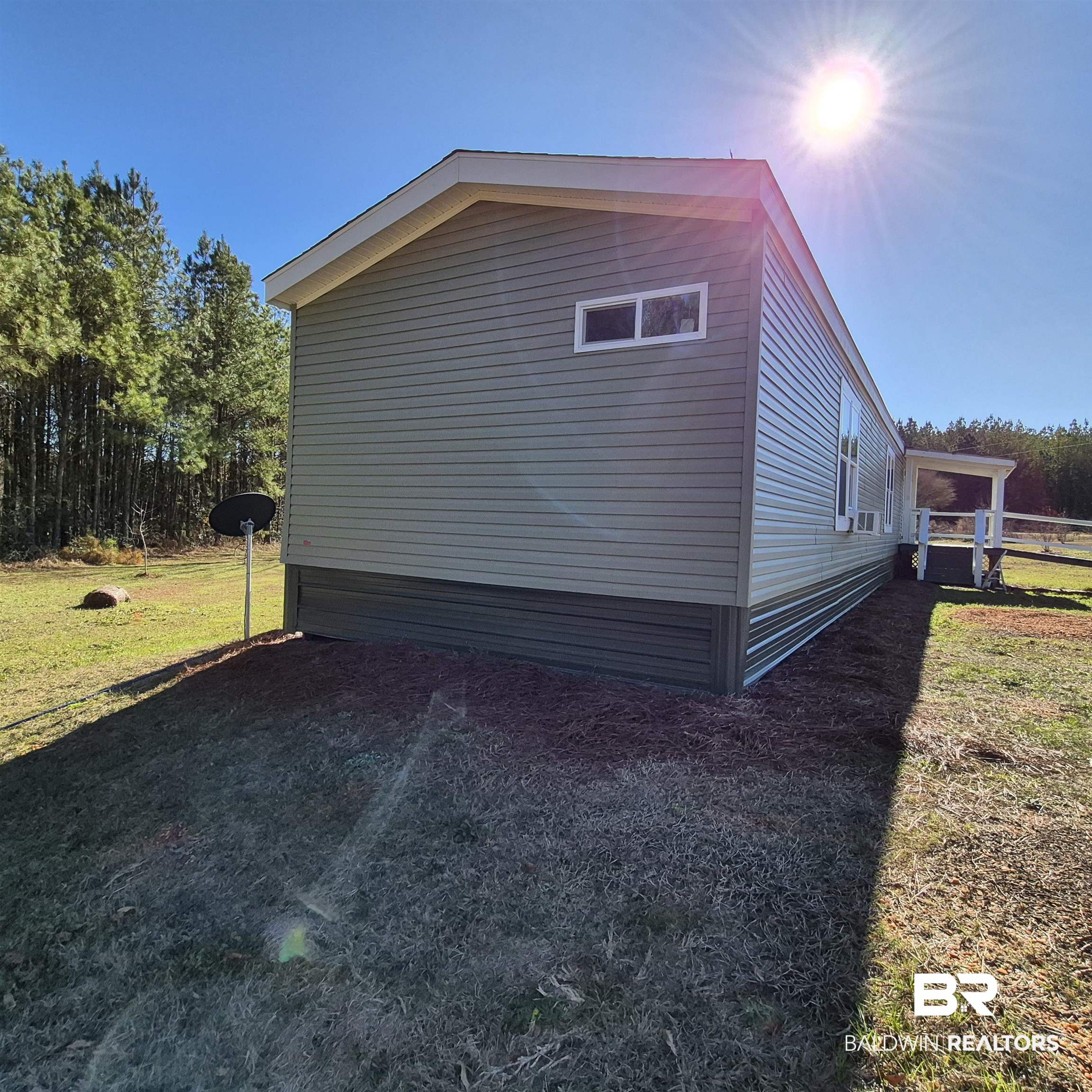 8867 Old Stage Road Repton, AL 36475 - Photo 36 of 37 View of home's exterior featuring a yard