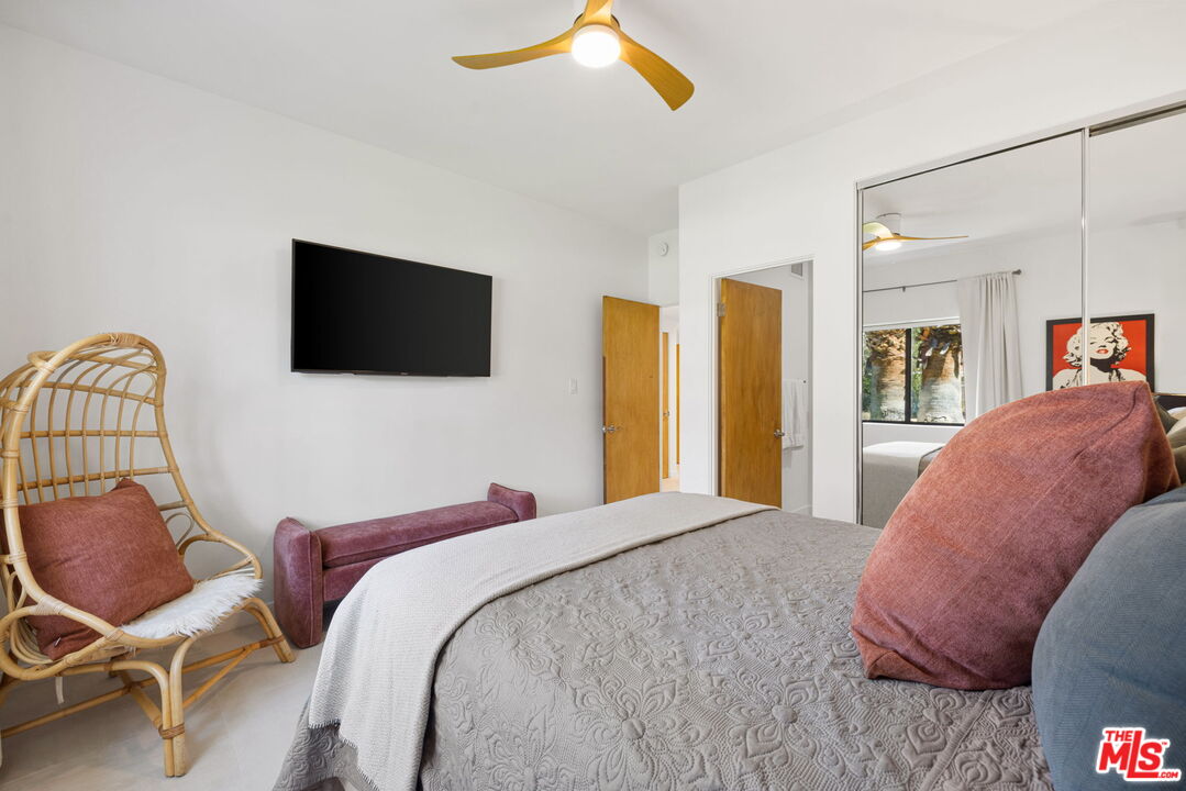 1414 Sagebrush Road Palm Springs, CA 92264 - Photo 35 of 48 a bedroom with a bed and a flat screen tv
