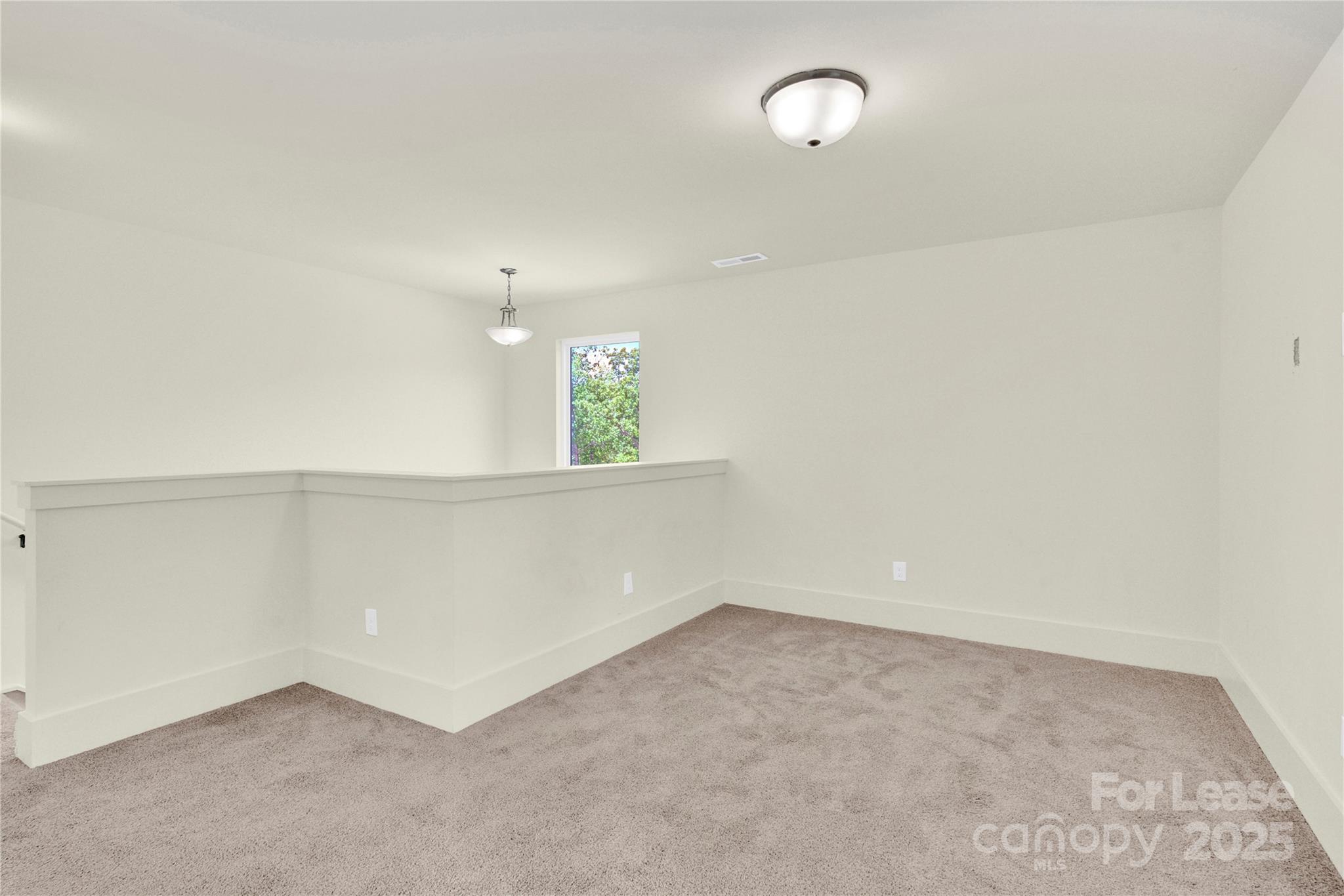 207 Aspire Circle, Unit 46 Wingate, NC 28174 - Photo 18 of 34 an empty room with stairs and white walls