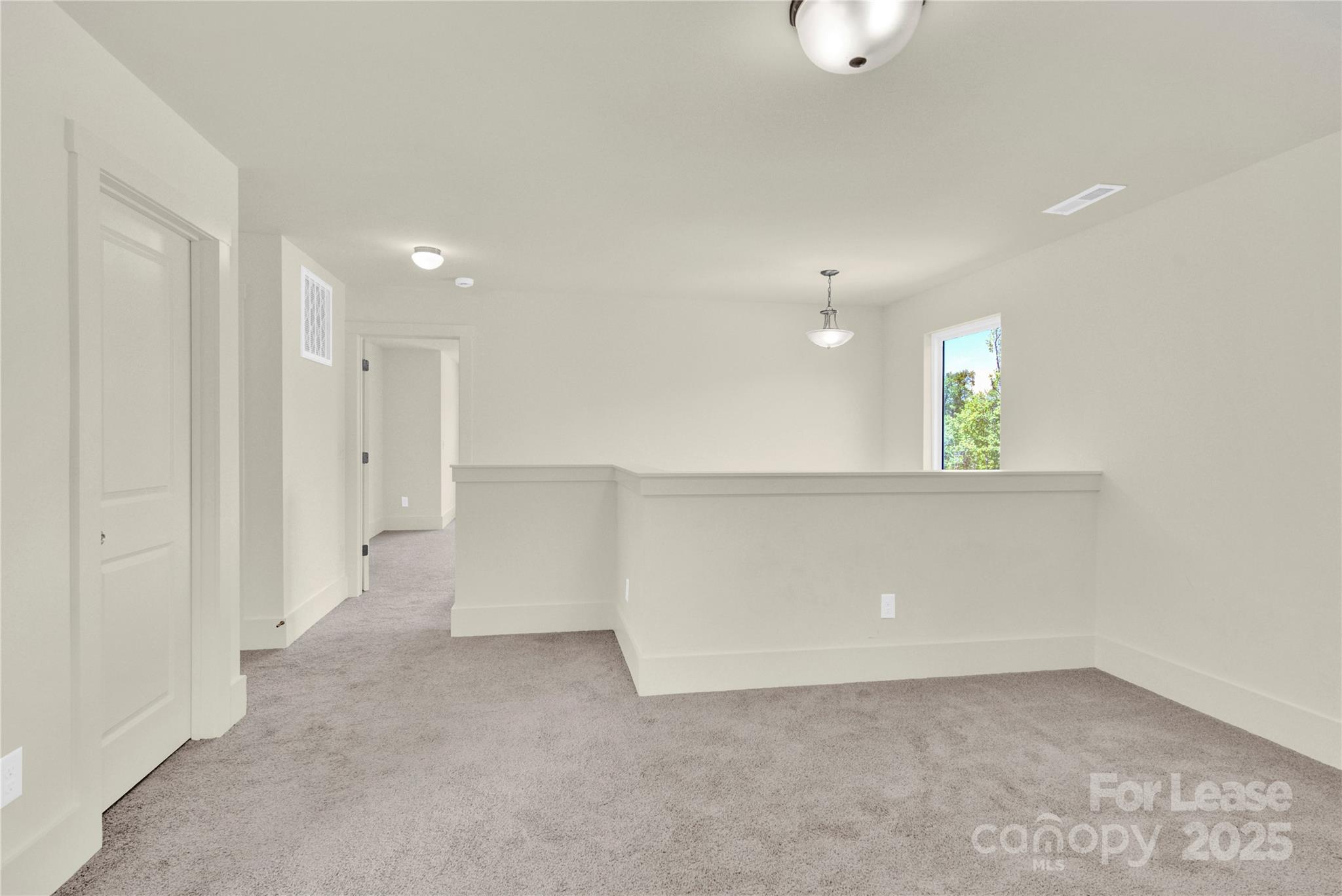 207 Aspire Circle, Unit 46 Wingate, NC 28174 - Photo 19 of 34 an empty room with a bathroom and mirror