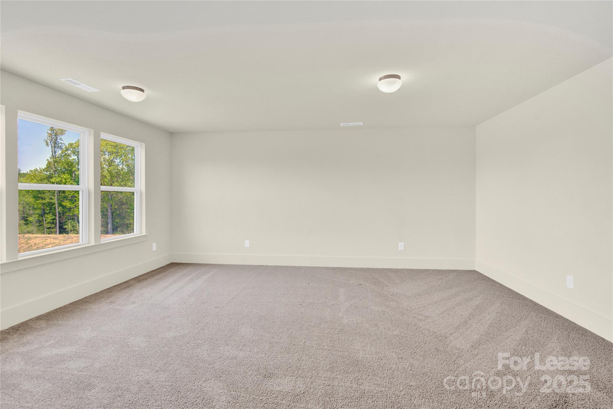 207 Aspire Circle, Unit 46 Wingate, NC 28174 - Photo 20 of 34 an empty room with a window