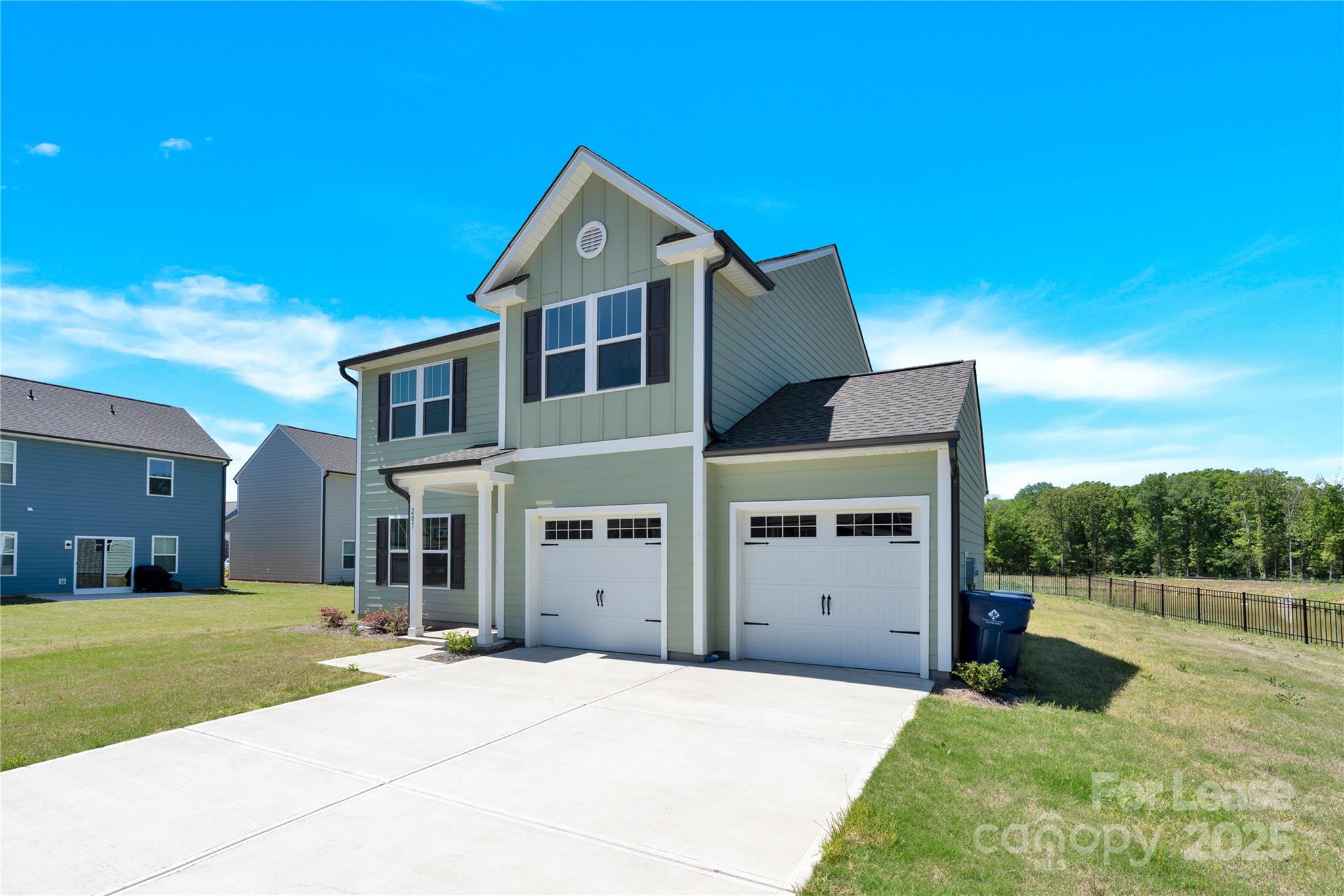 207 Aspire Circle, Unit 46 Wingate, NC 28174 - Photo 2 of 34 a front view of a house with a yard