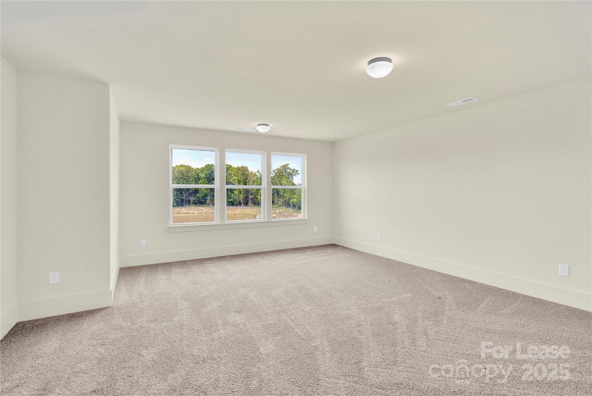 207 Aspire Circle, Unit 46 Wingate, NC 28174 - Photo 21 of 34 an empty room with windows