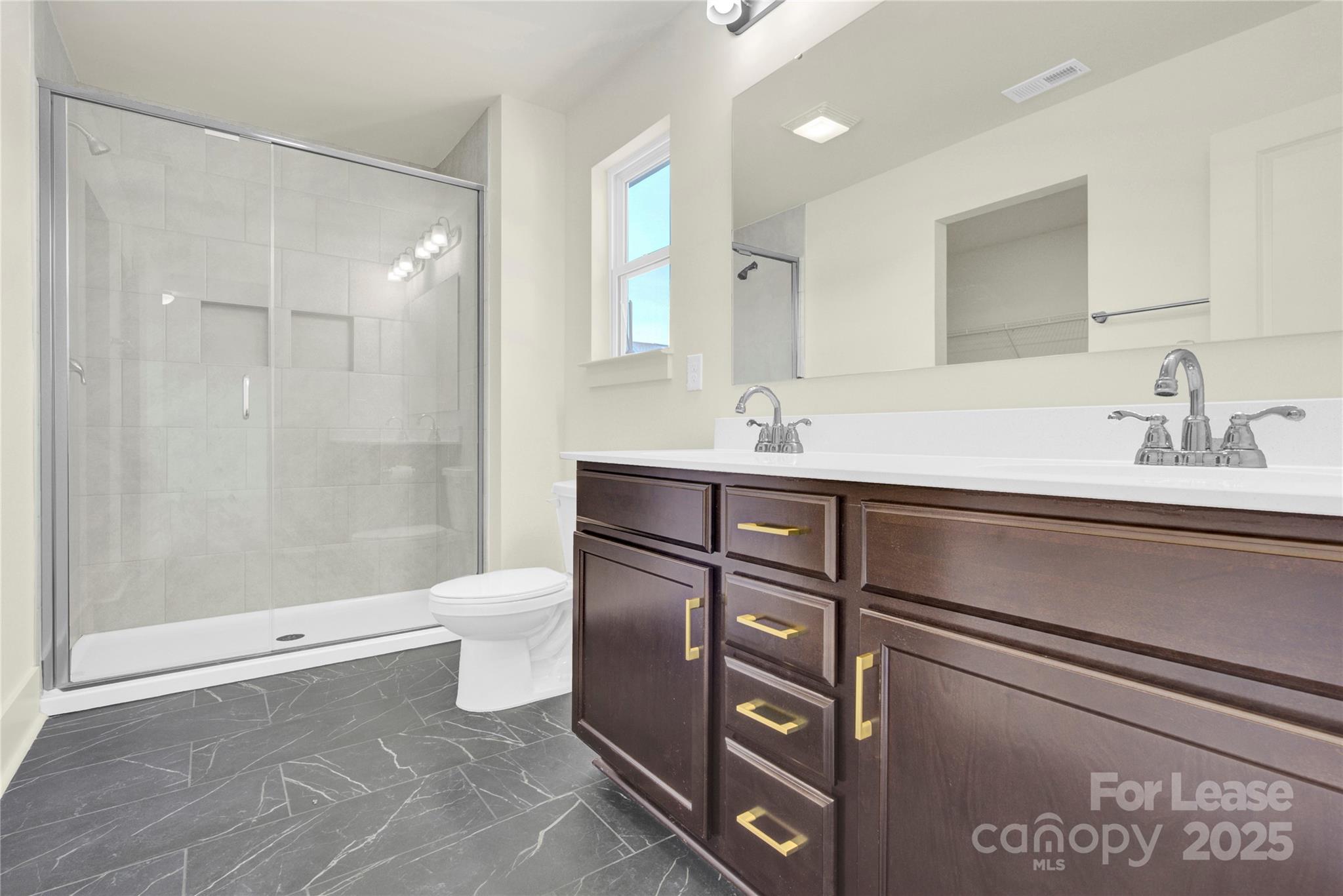 207 Aspire Circle, Unit 46 Wingate, NC 28174 - Photo 24 of 34 a bathroom with a sink a toilet and shower