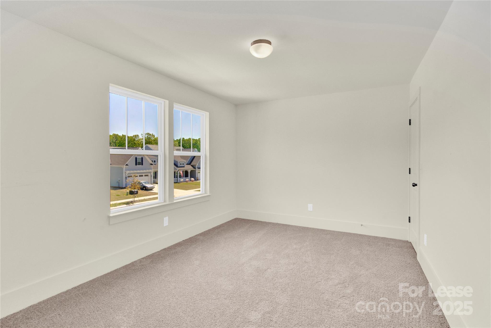 207 Aspire Circle, Unit 46 Wingate, NC 28174 - Photo 27 of 34 an empty room with windows