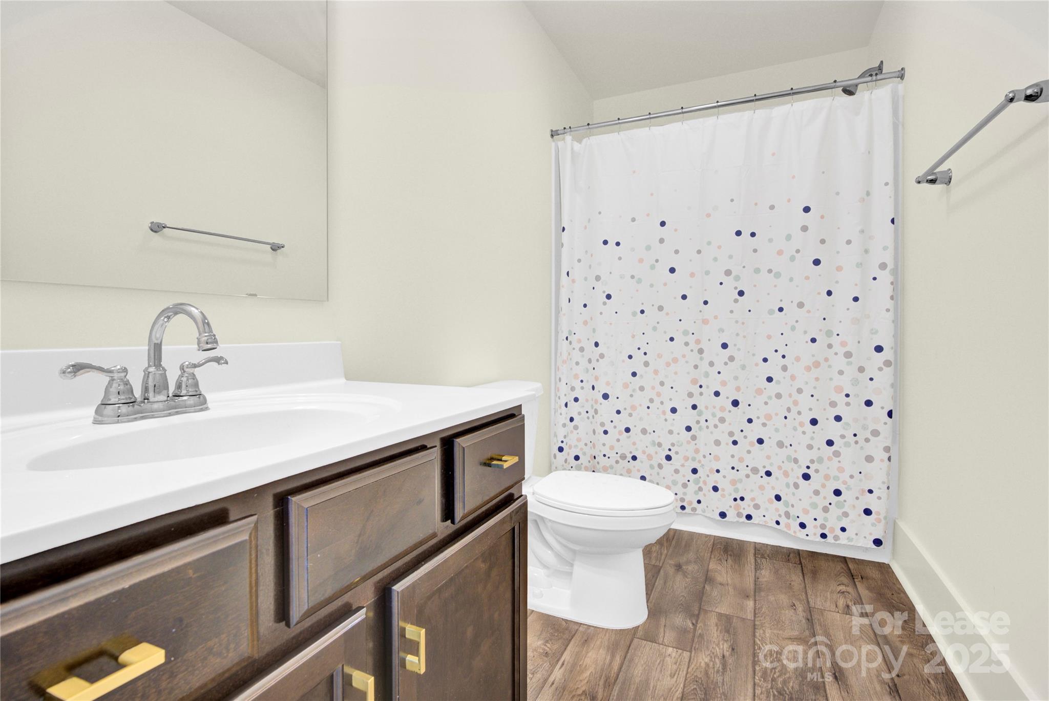 207 Aspire Circle, Unit 46 Wingate, NC 28174 - Photo 28 of 34 a bathroom with a sink toilet and shower
